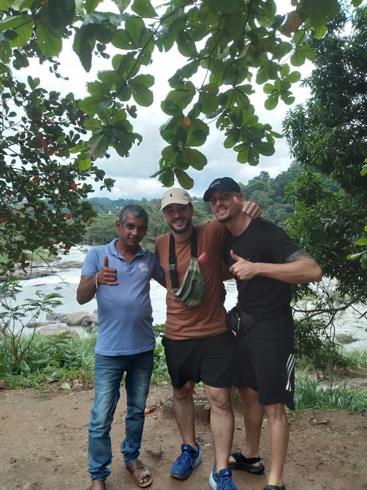 Asanka with two travelers by the Mahaweli river near Peradeniya, Kandy