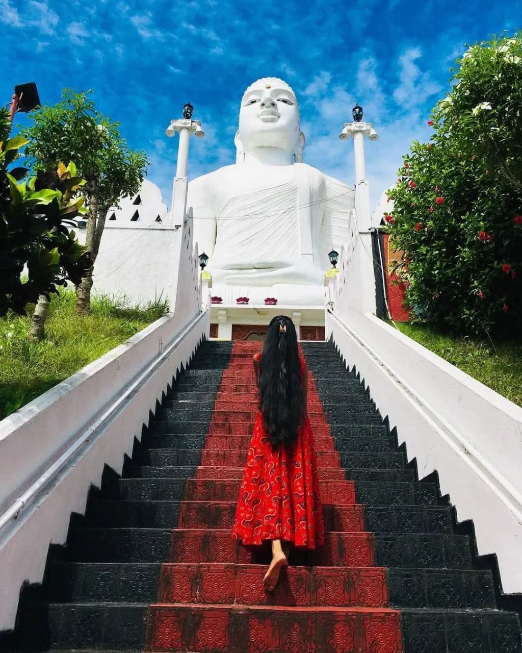 The huge white Bahirawakanda Vihara Buddha statue seen from the temple steps above Kandy